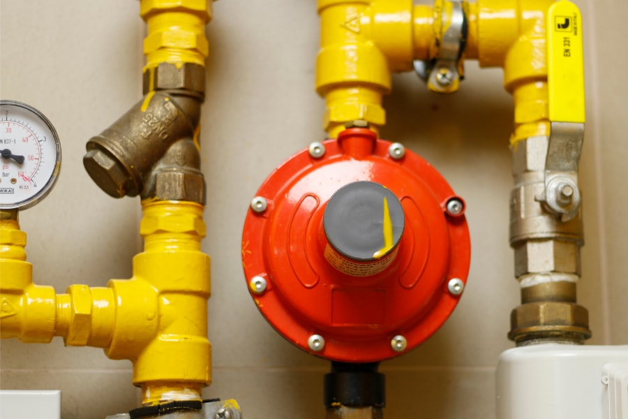 Yellow liquid petroleum gas( LPG ) pipe line and red safety valve